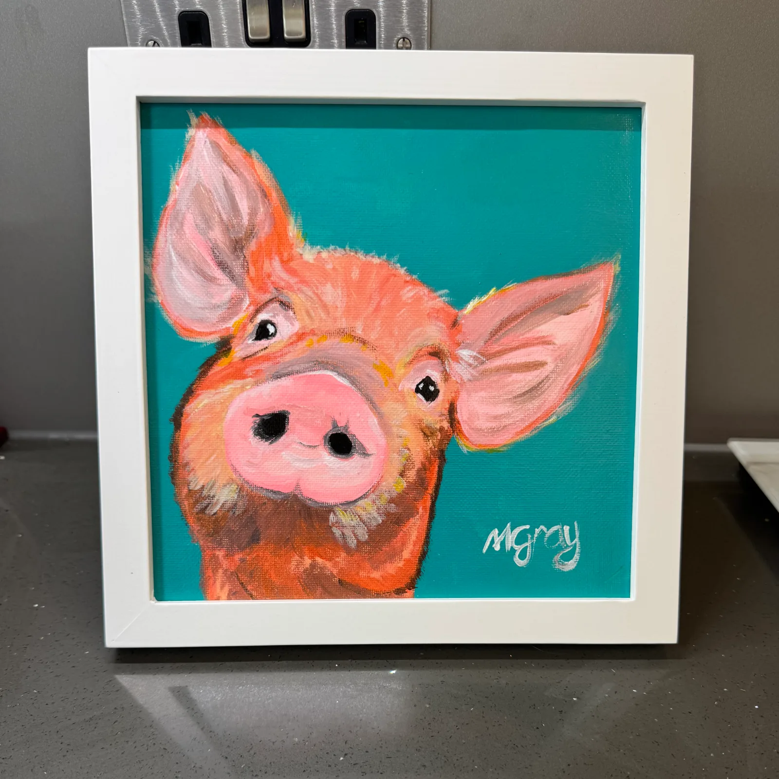 20 x 20 cm acrylic painting of a ginger pig on a dark cyan background. White wooden frame included.
