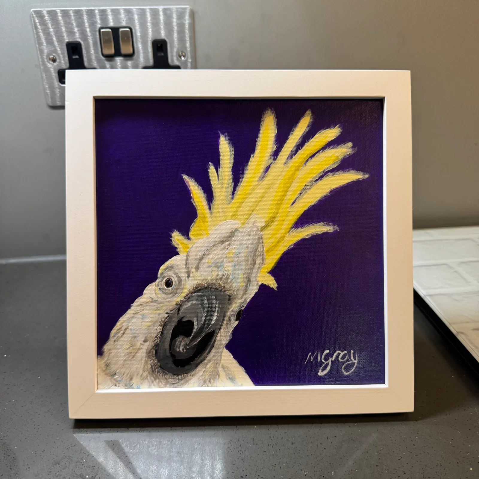 20 x 20 cm acrylic painting of a Cockatoo on a purple background. White wooden frame included.